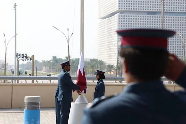 Qatar and UN flags raised for the Social Development Summit